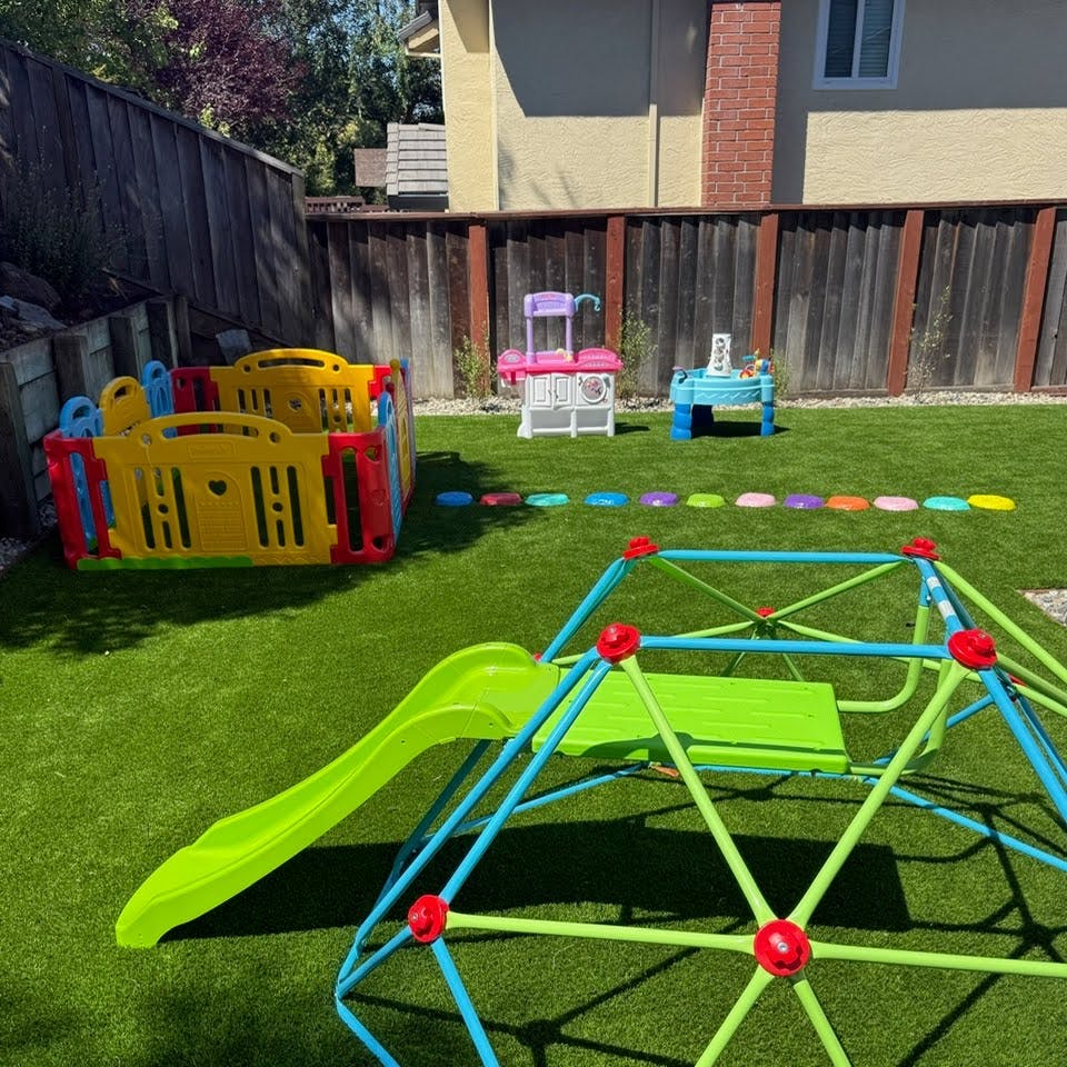 Playground equipment including a climbing dome with slide and play enclosure