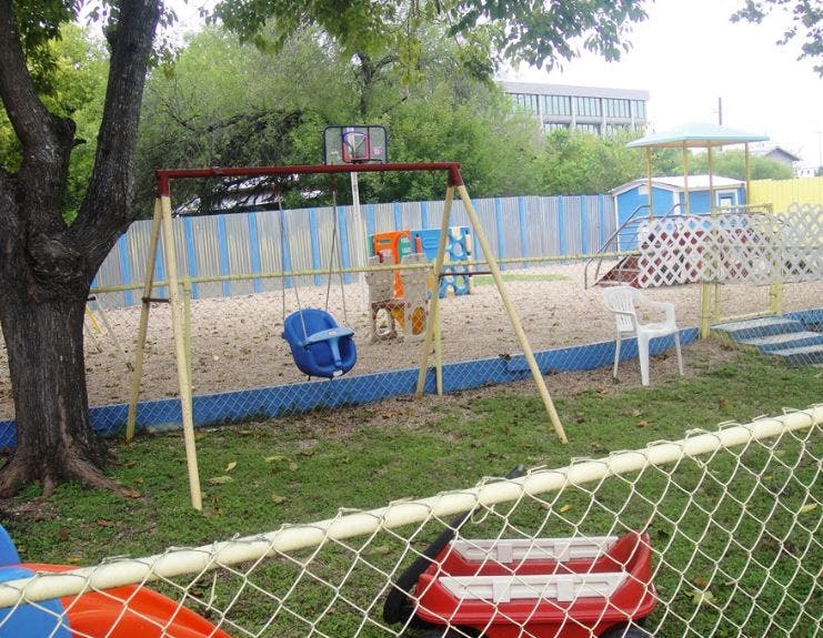 Empty playground with a swing set and sandbox