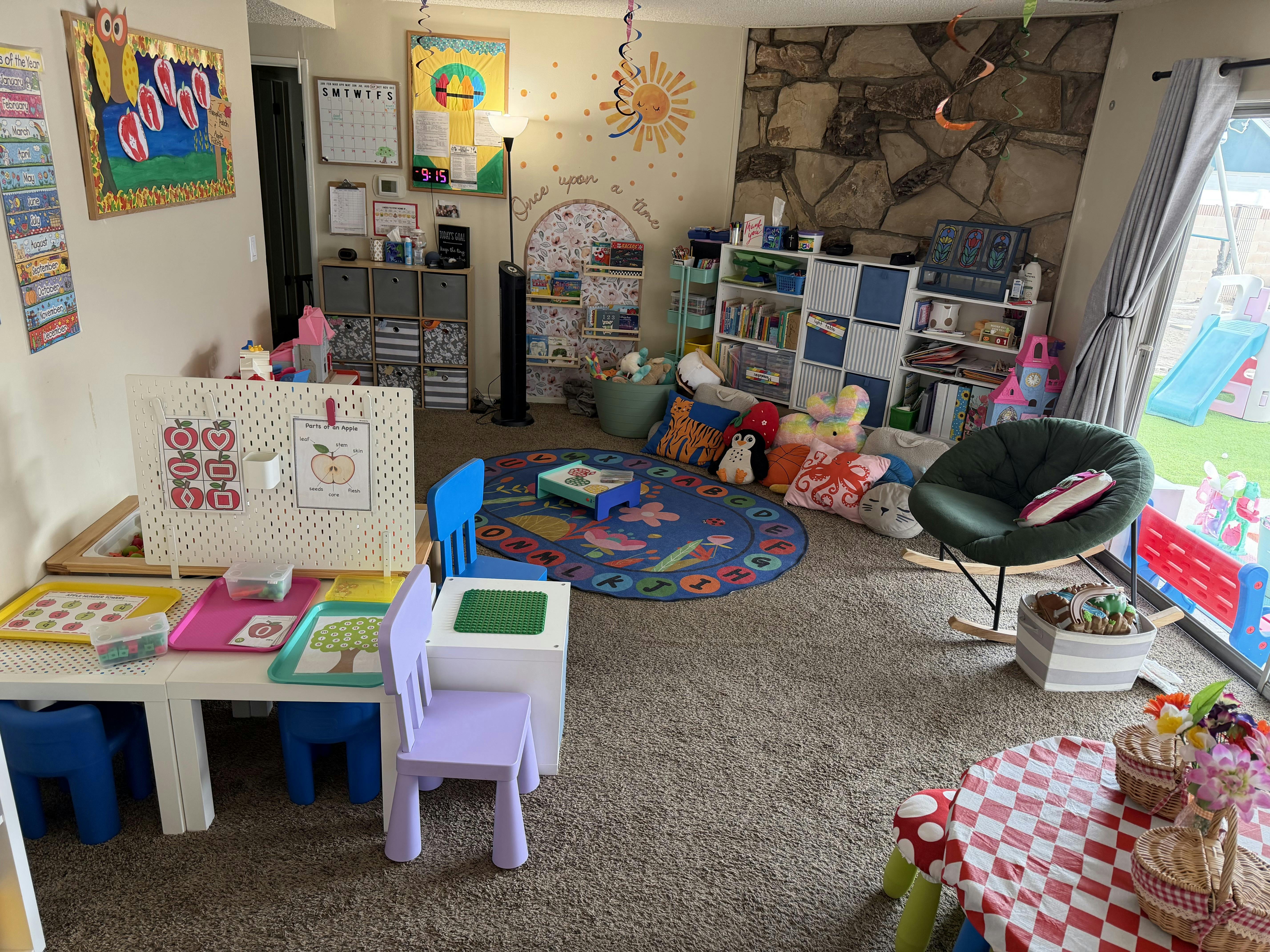 Colorful playroom for children with learning materials and activity stations