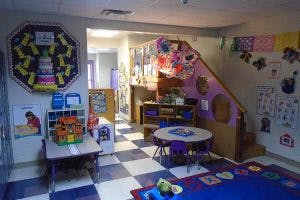 Classroom with tables, chairs, and decorated walls