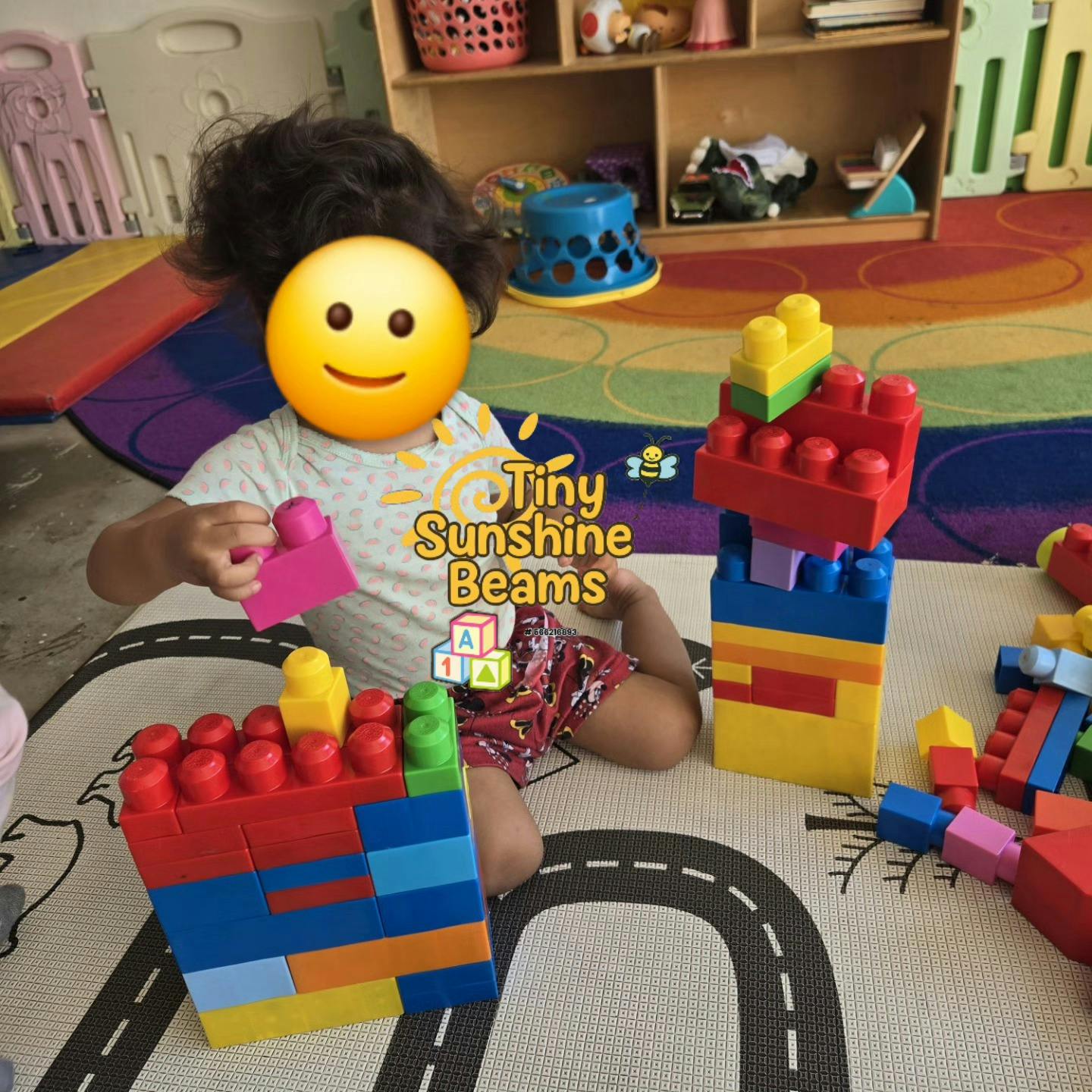 Child playing with colorful building blocks