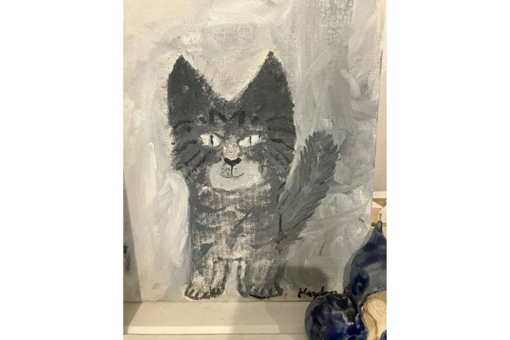 Painting of a cat against a light background