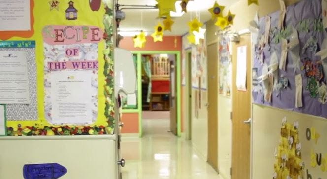 Hallway decorated with paper stars and bulletin boards