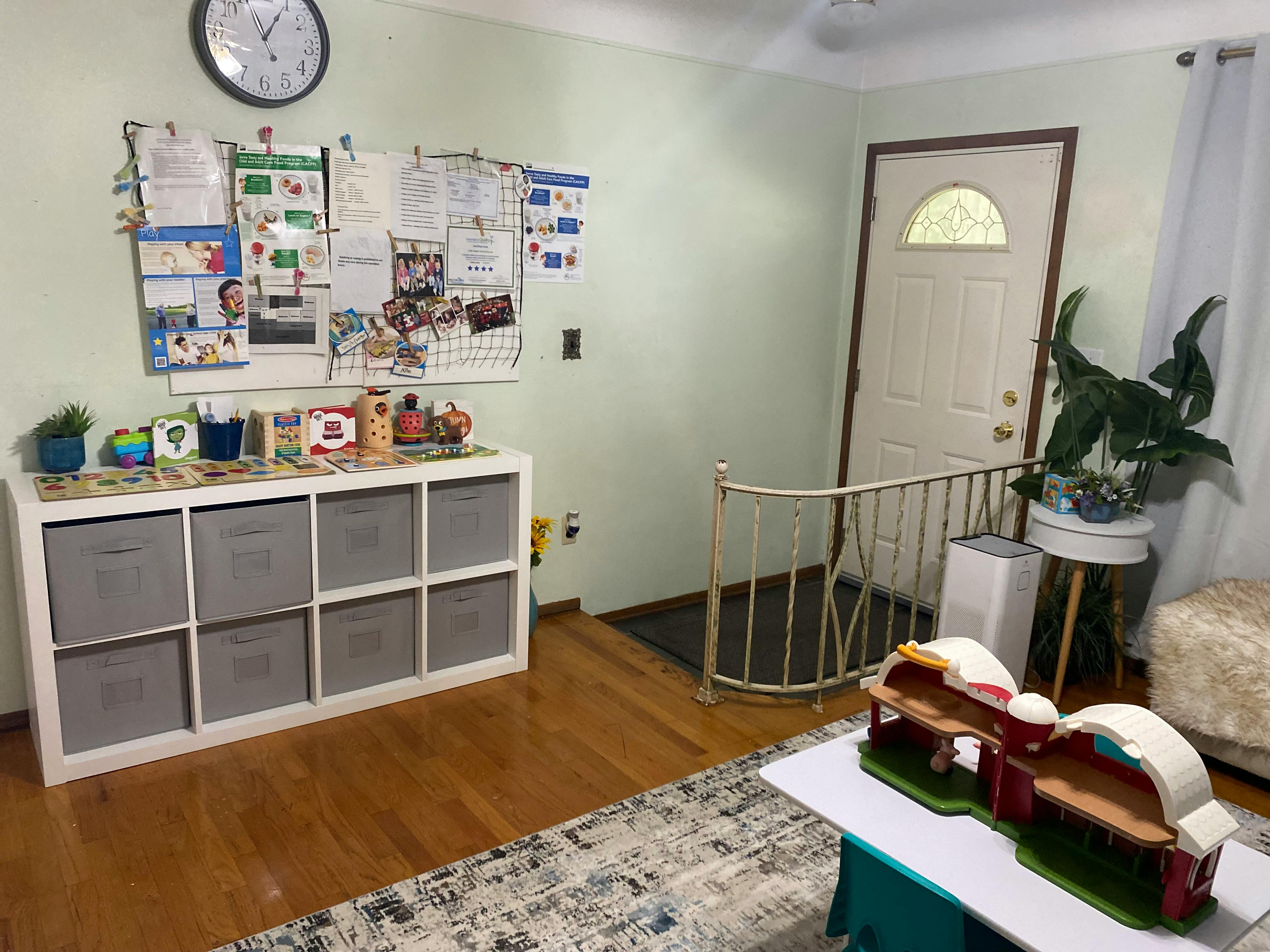 Storage unit with bins, bulletin board, and front door with railing