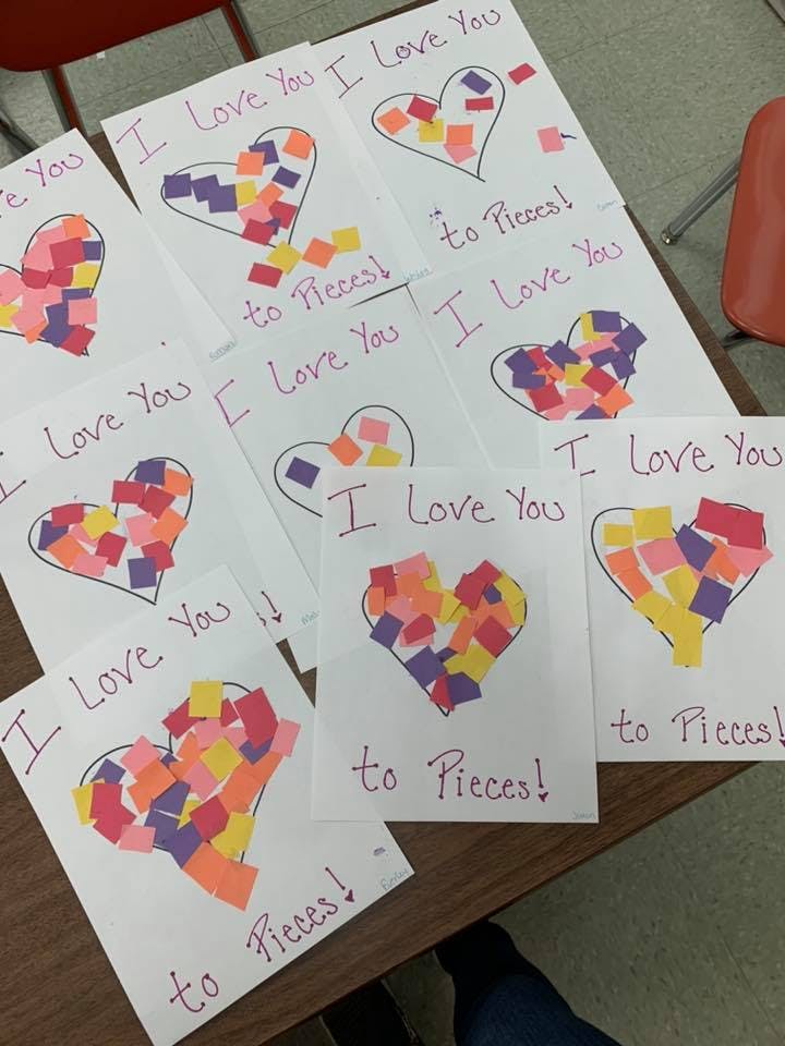 Multiple handmade cards with hearts made of colorful paper squares and text "I Love You to Pieces"
