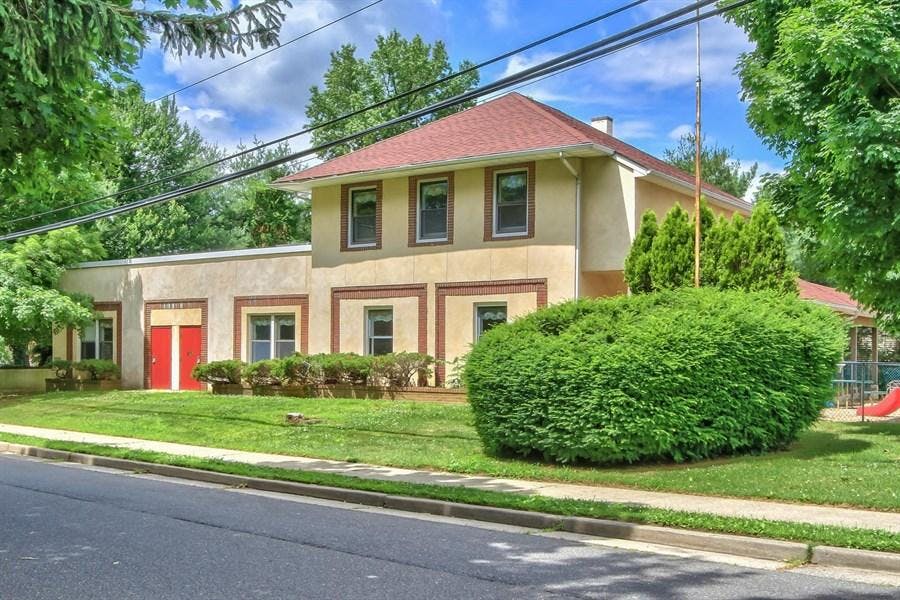 Building with red roof and red garage doors