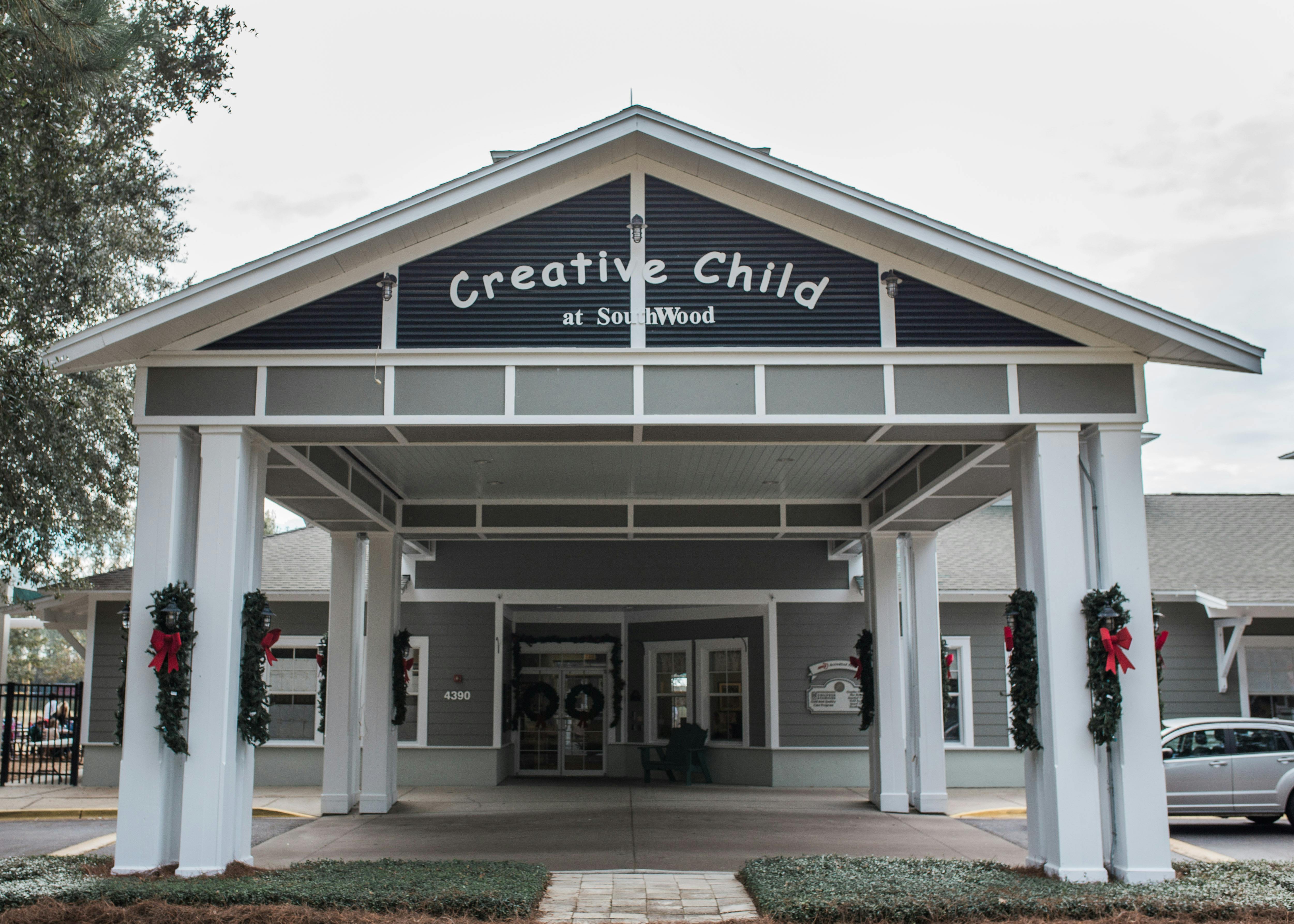 Building entrance with "Creative Child at SouthWood" sign