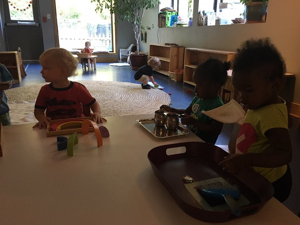Children playing with toys in a classroom