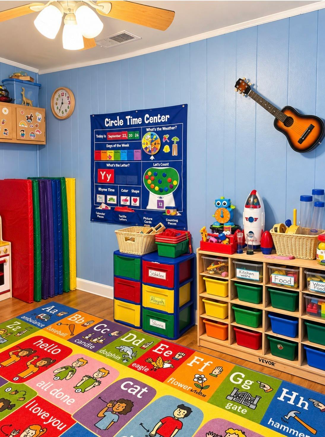 Classroom with educational wall chart, toy storage bins, and alphabet floor mat
