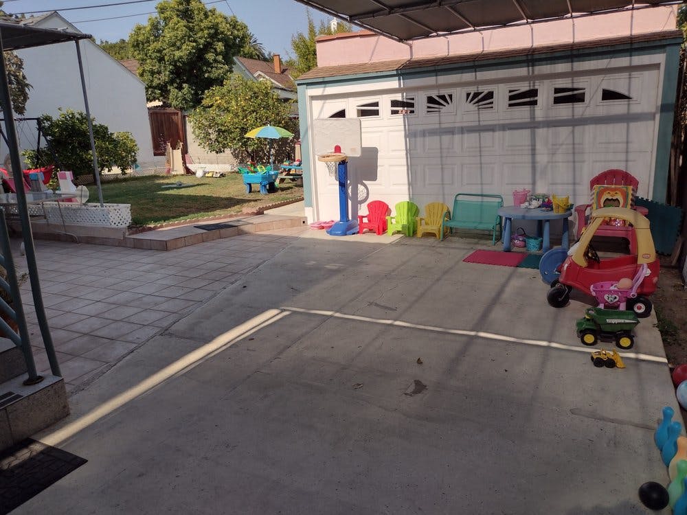 Backyard with children's toys and a garage