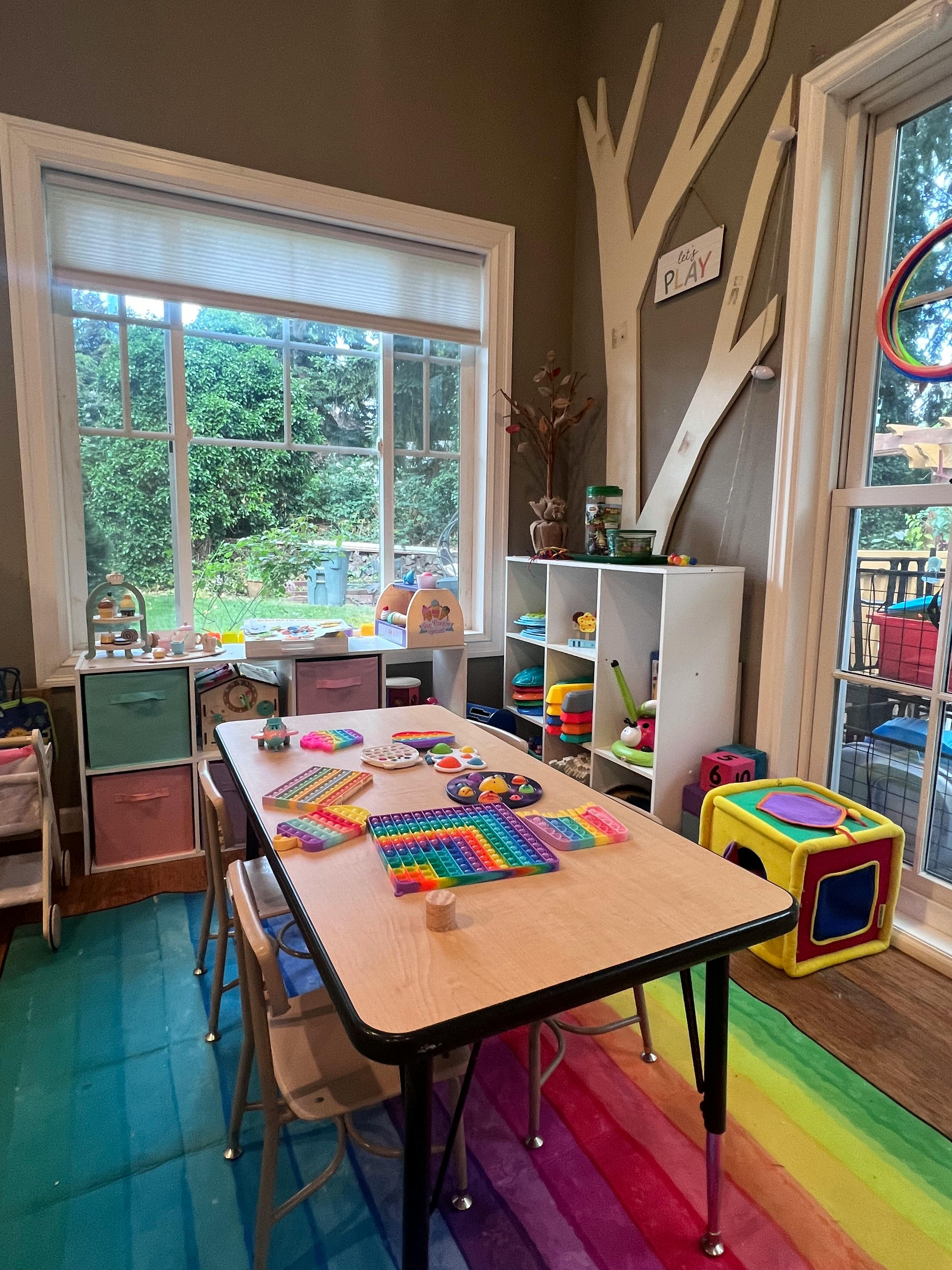 Classroom with a table covered in pop-it toys