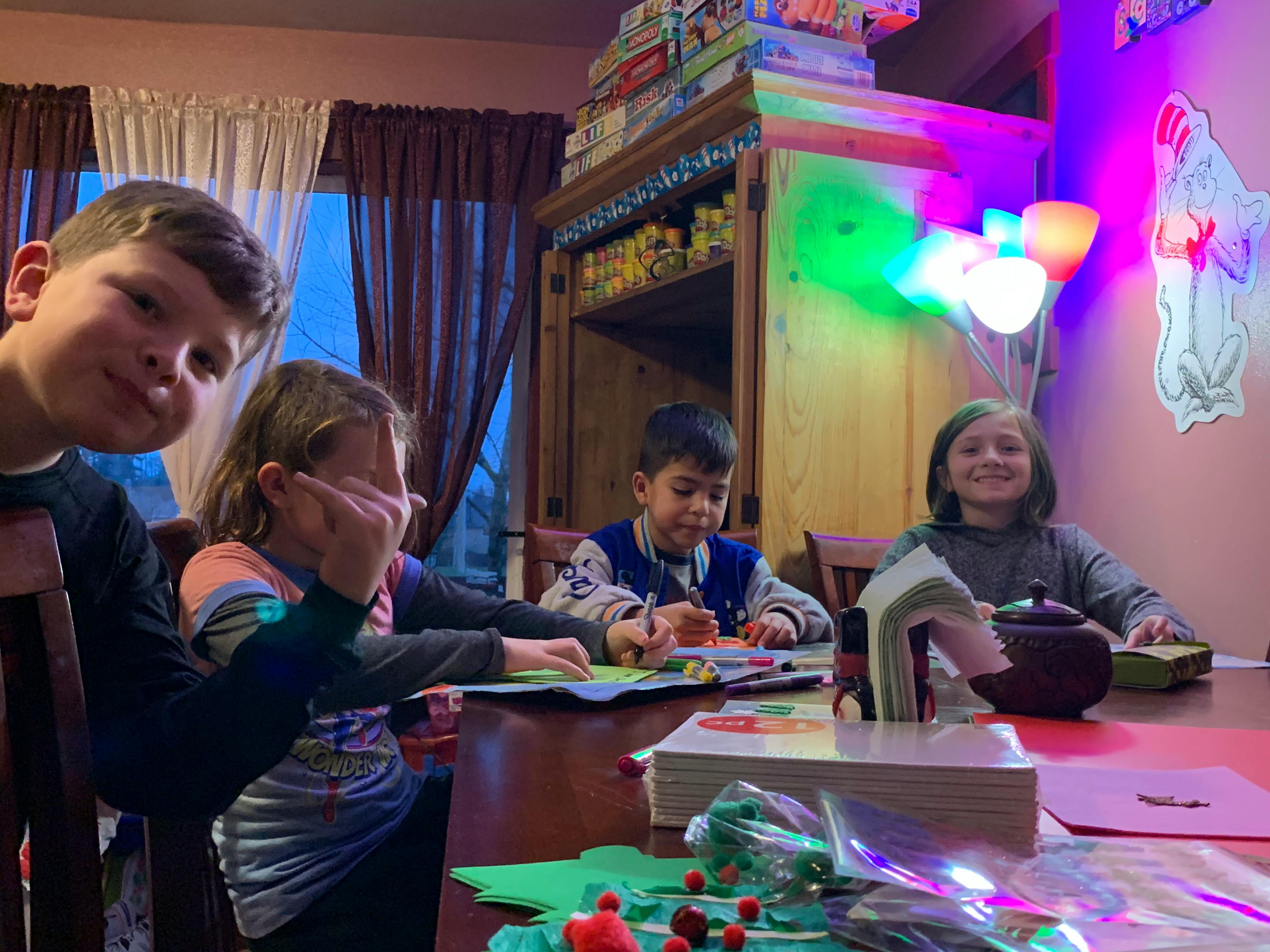 Four children sitting at a table