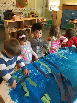 Children doing an art project in a classroom