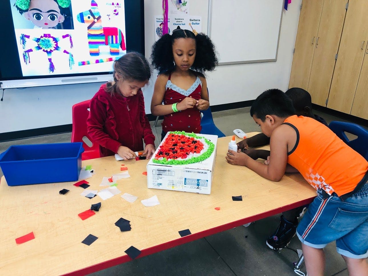 Children doing crafts at a table
