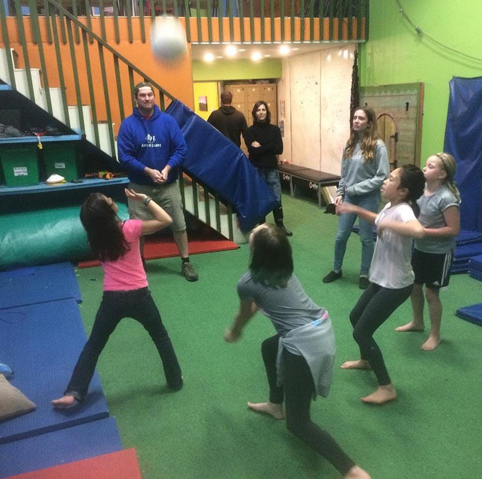 People playing with a ball in a gym