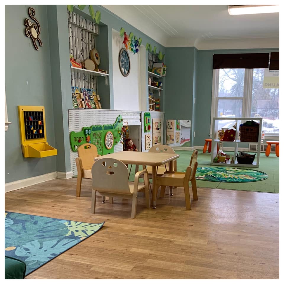 Children's classroom with small tables and chairs