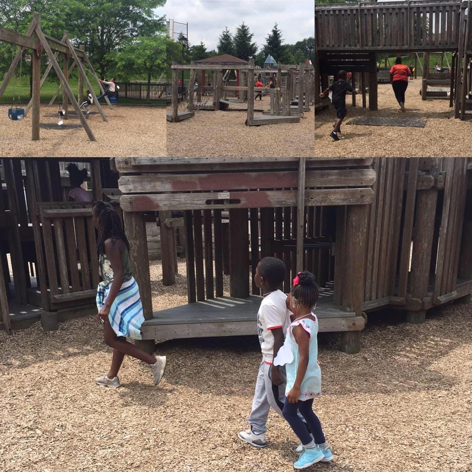 Children playing on wooden playground structures