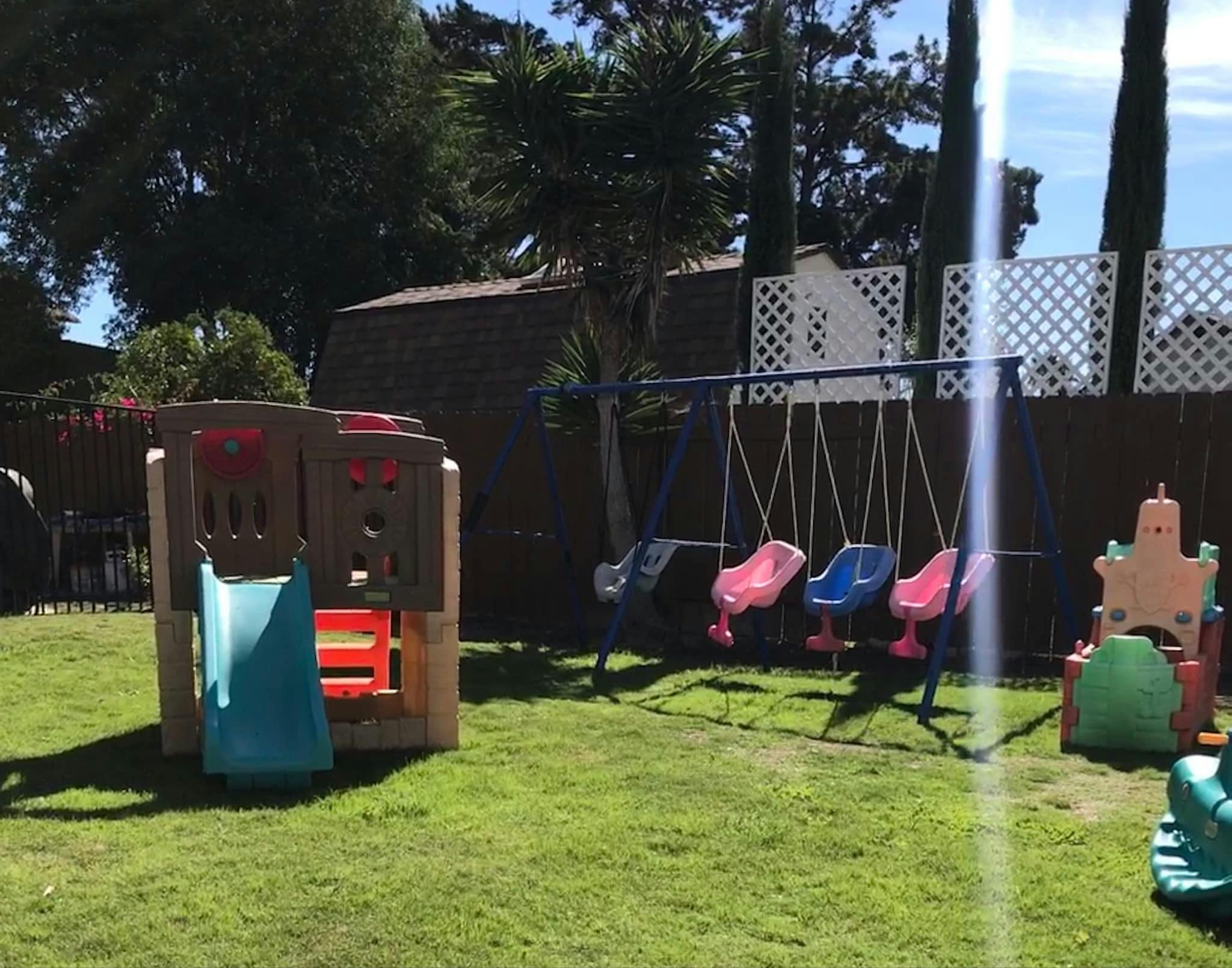 Playground with a slide and a swing set