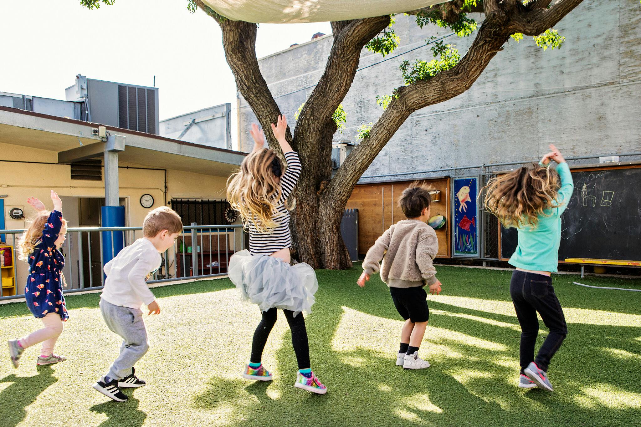 Children playing outdoors on artificial turf