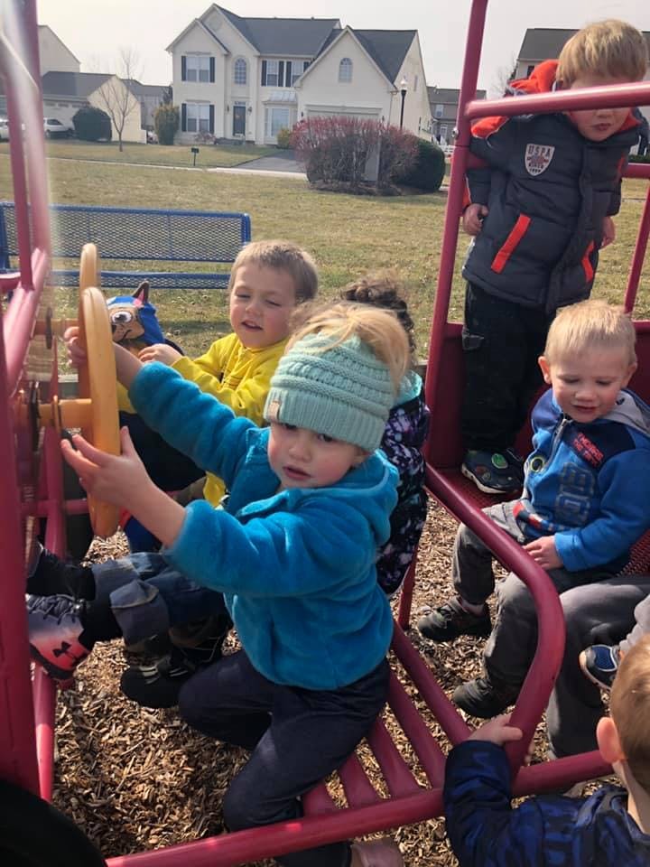 Children playing on a playground structure