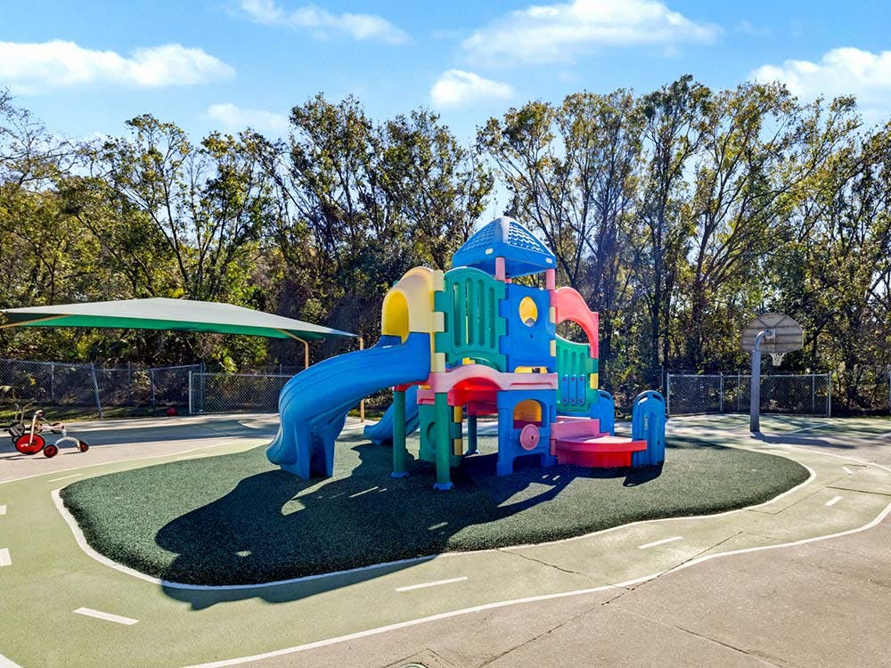 Colorful playground structure on soft ground