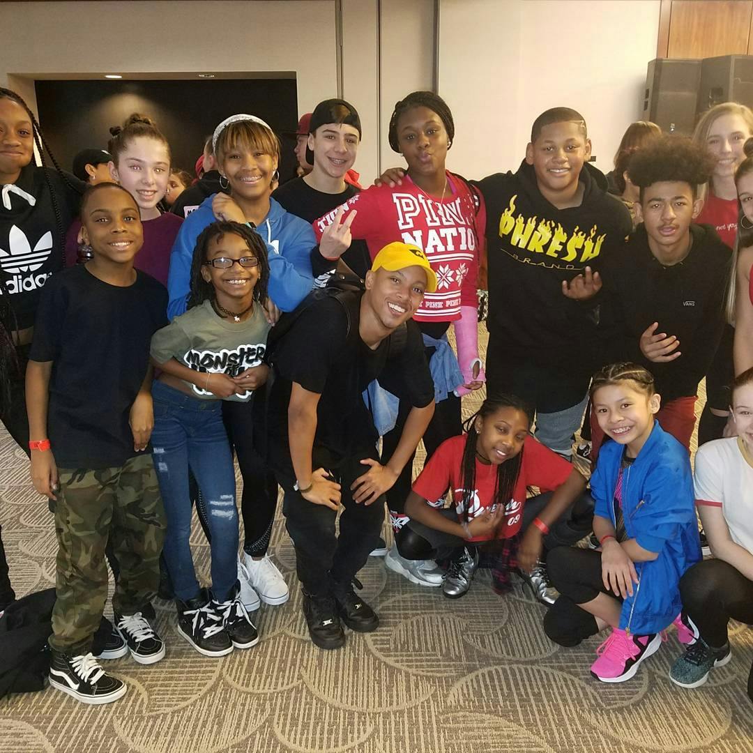 Group of teens and children posing together