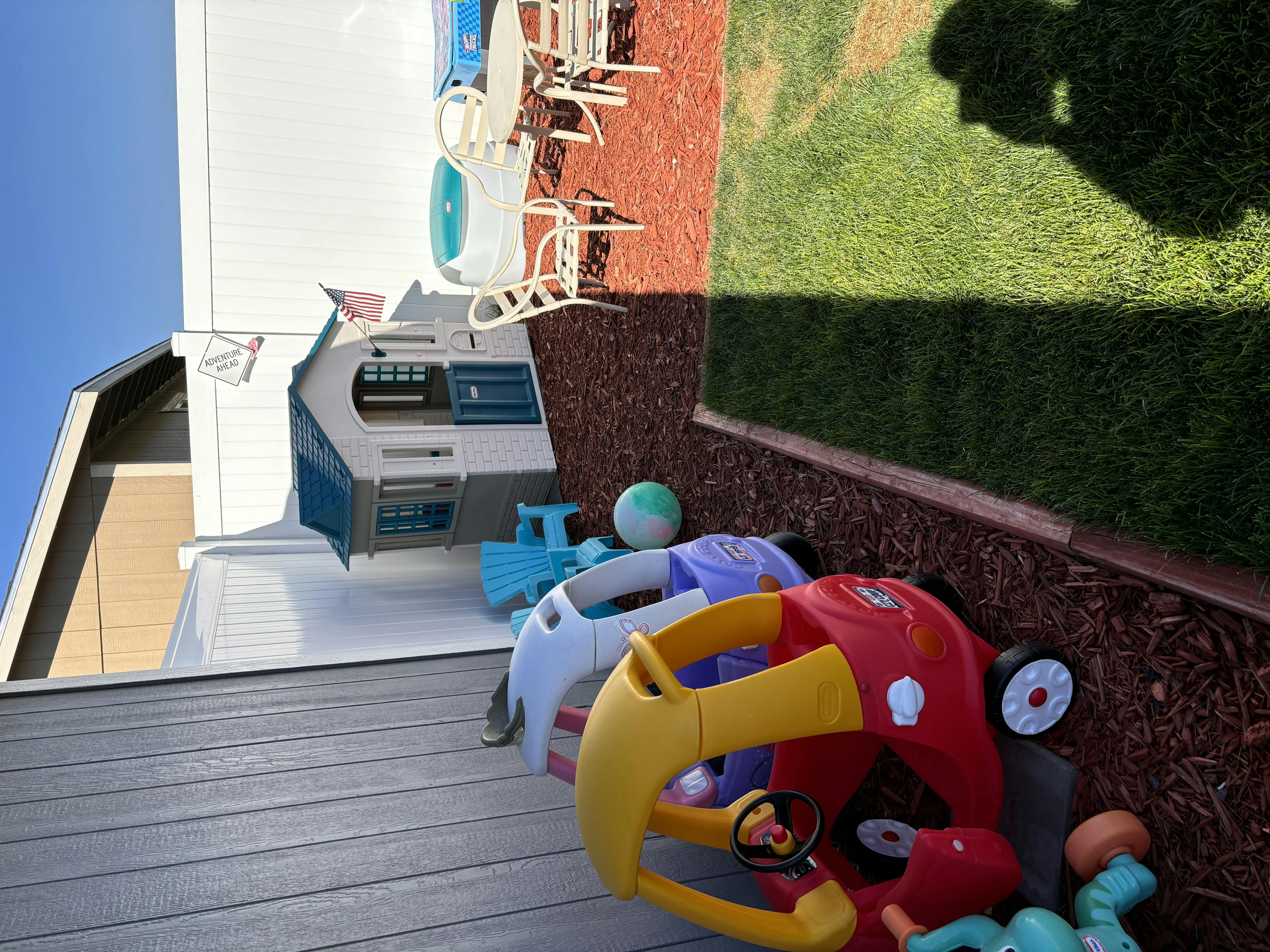Children's outdoor play kitchen and ride-on toys