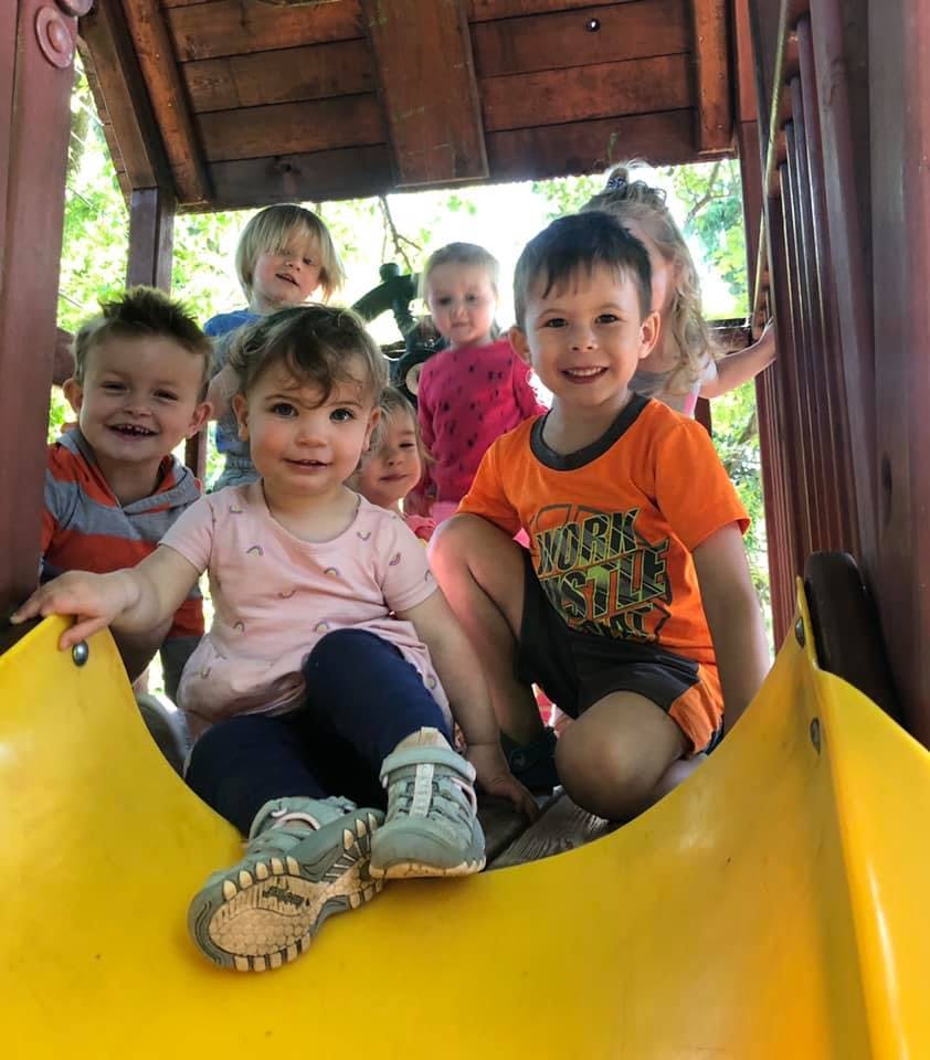 Group of children on a playground slide