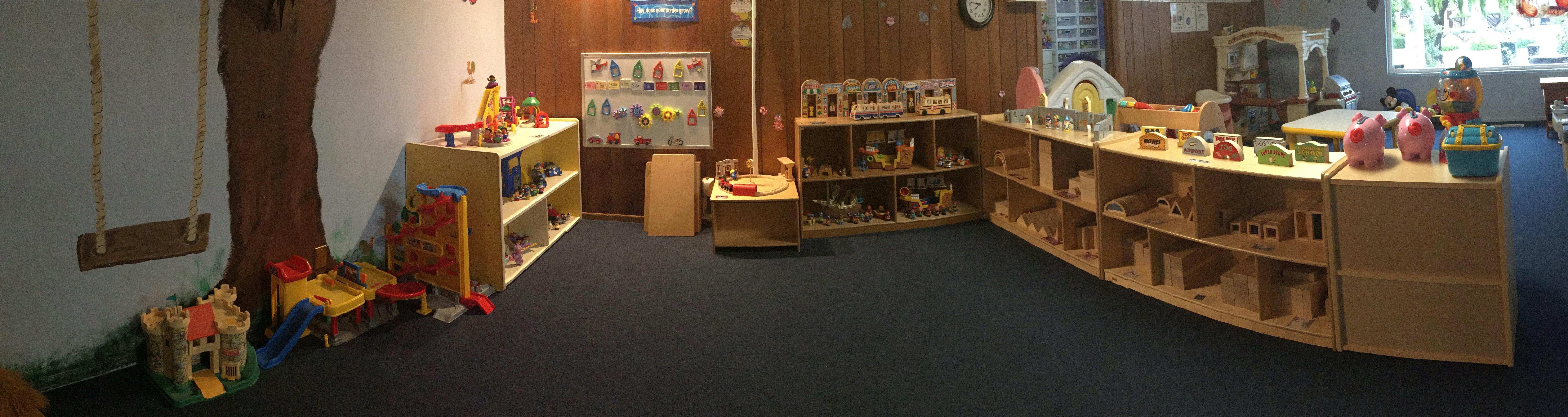 Playroom with shelves of toys and a swing