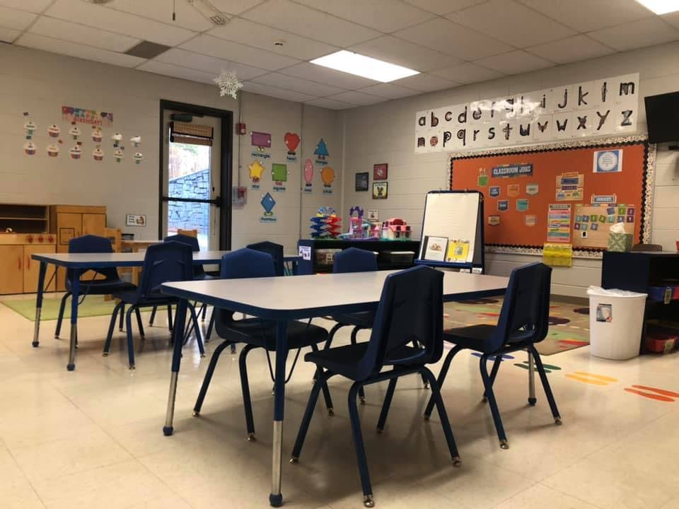 Empty classroom with tables and chairs