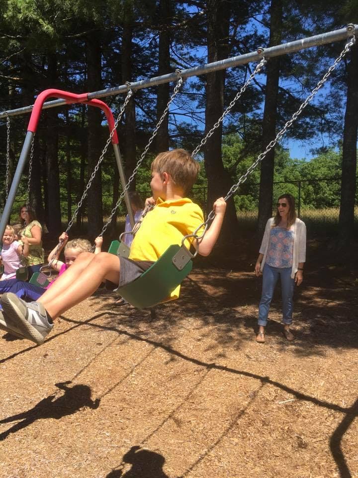 Child on a swing at a playground