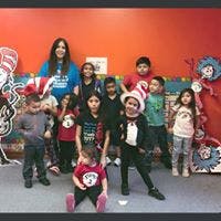 Adult and children posing in a room with decorations
