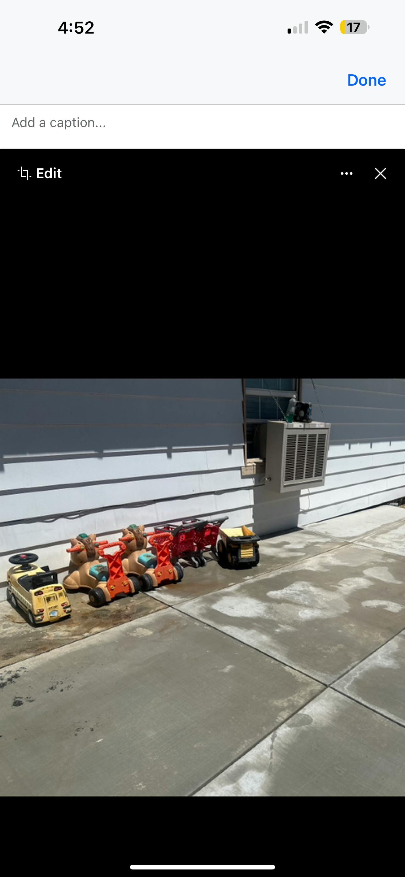 Toy vehicles on a concrete surface next to a building