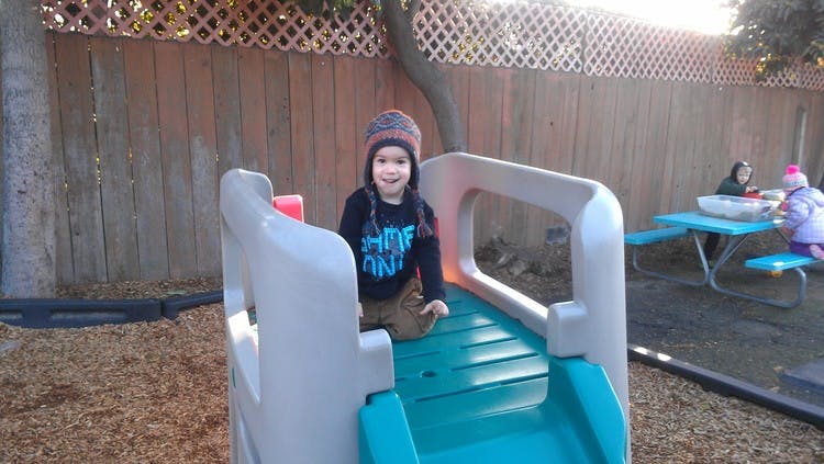 Child on a playground slide
