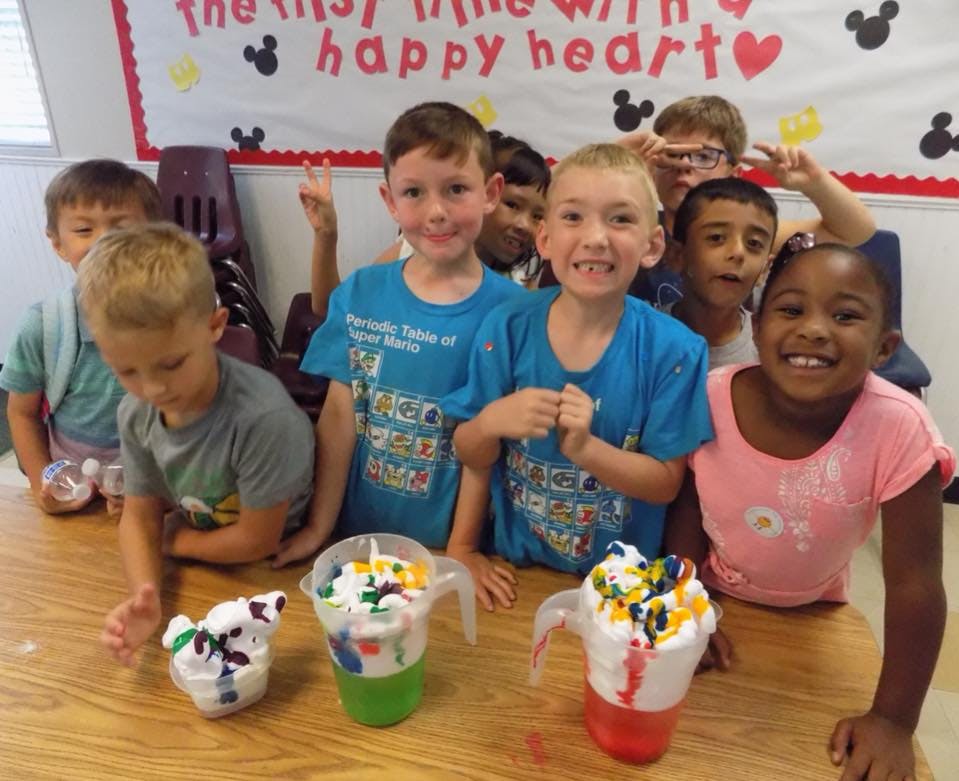 Children making crafts at a table