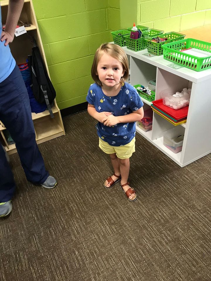 Child standing in a room