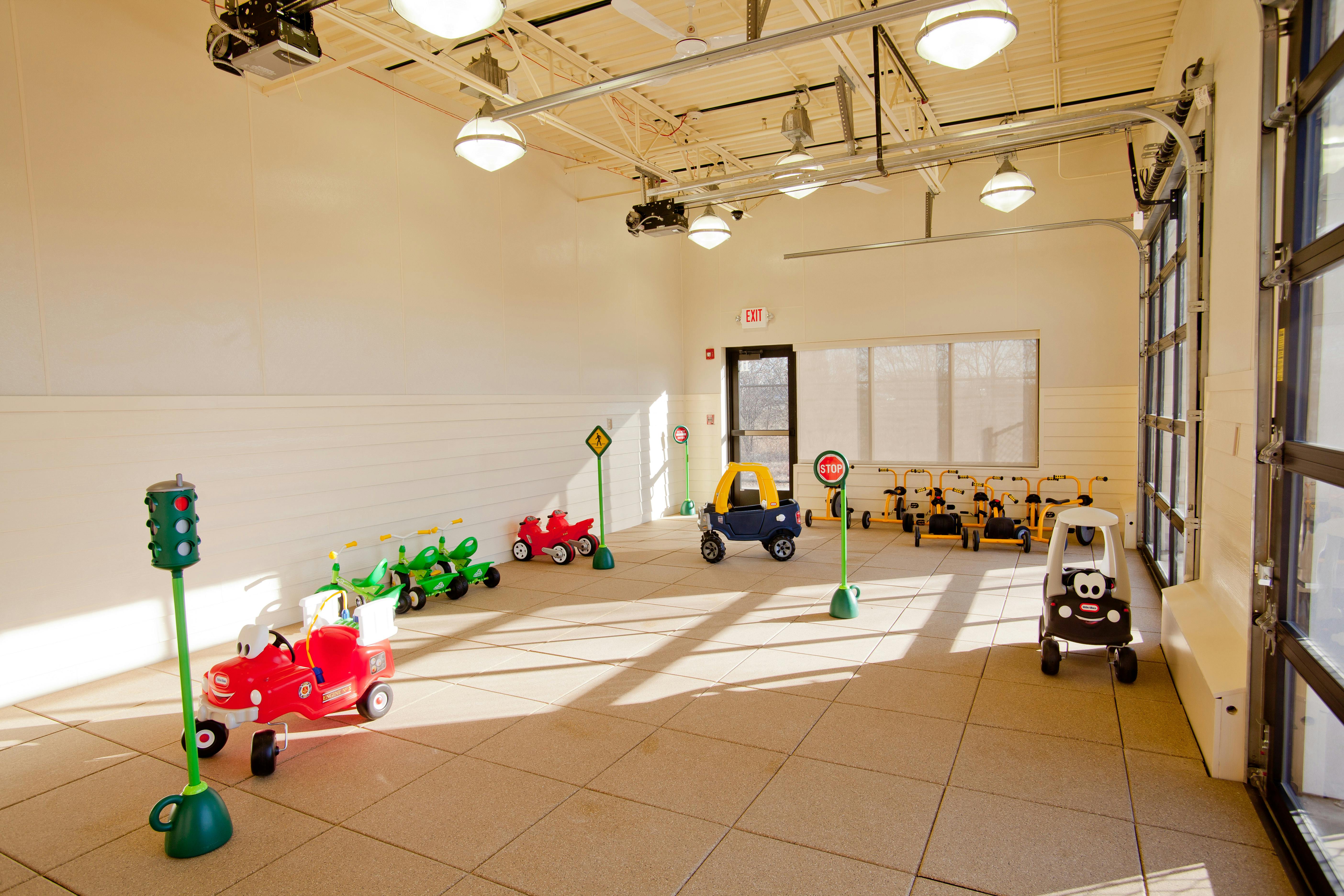 Playroom with toy cars and traffic signs