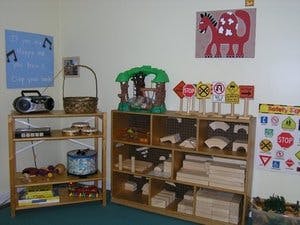 Classroom with shelves of toys, a radio, and traffic signs