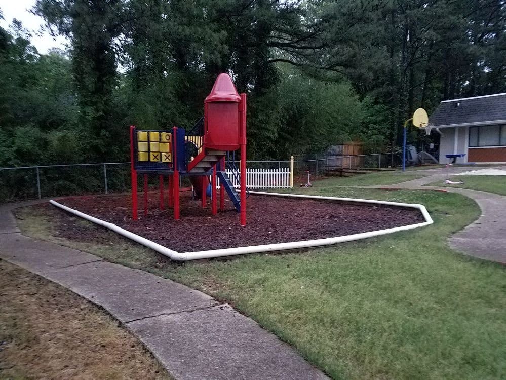 Playground with red and blue play structure