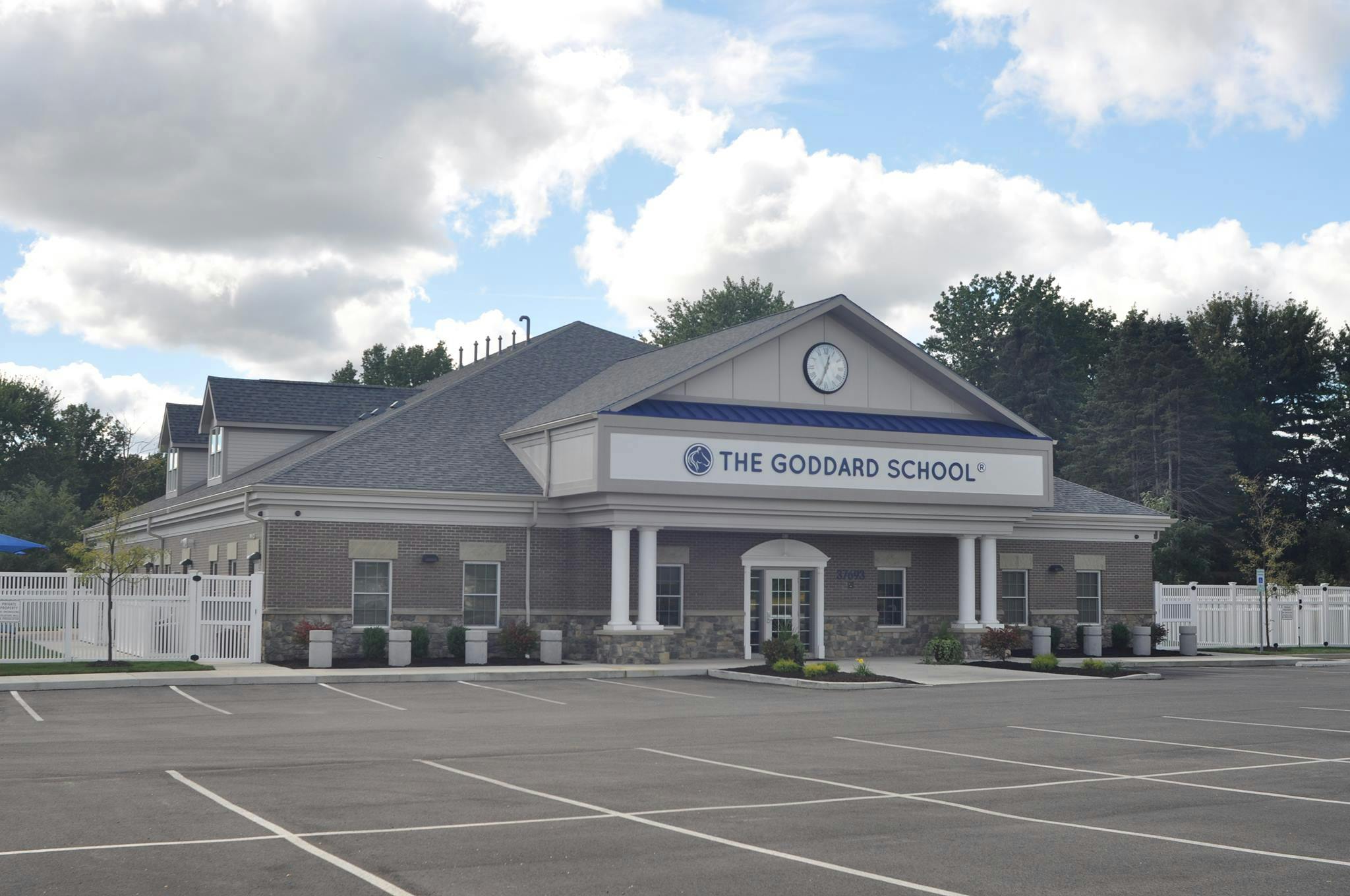 The Goddard School building with a parking lot in front