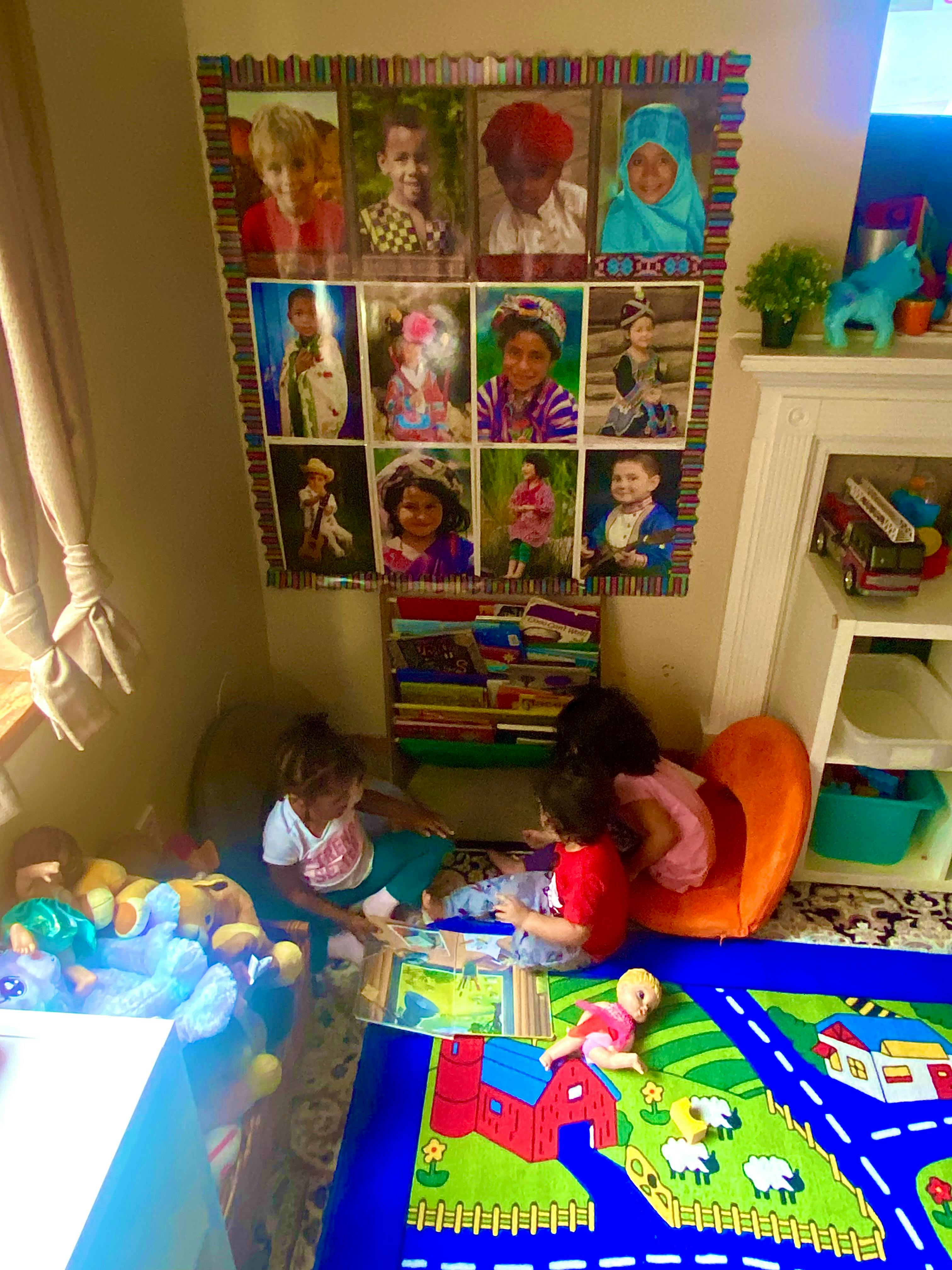 Children playing on the floor with toys and books