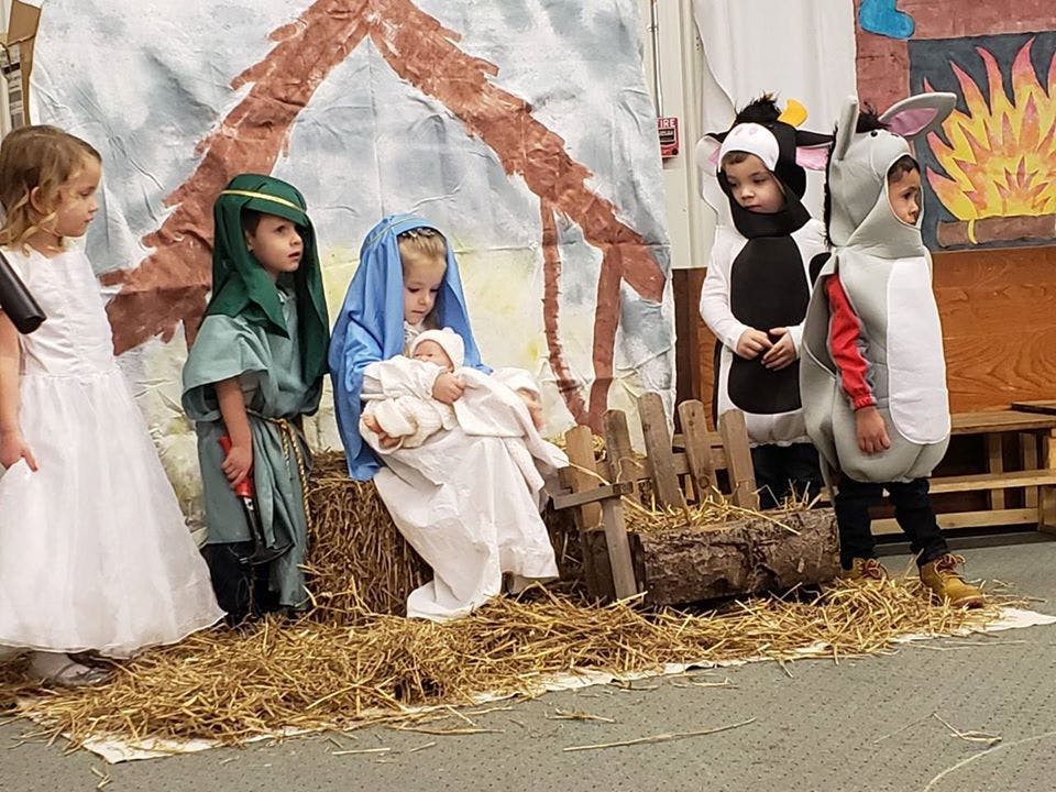 Children in costumes performing a nativity scene