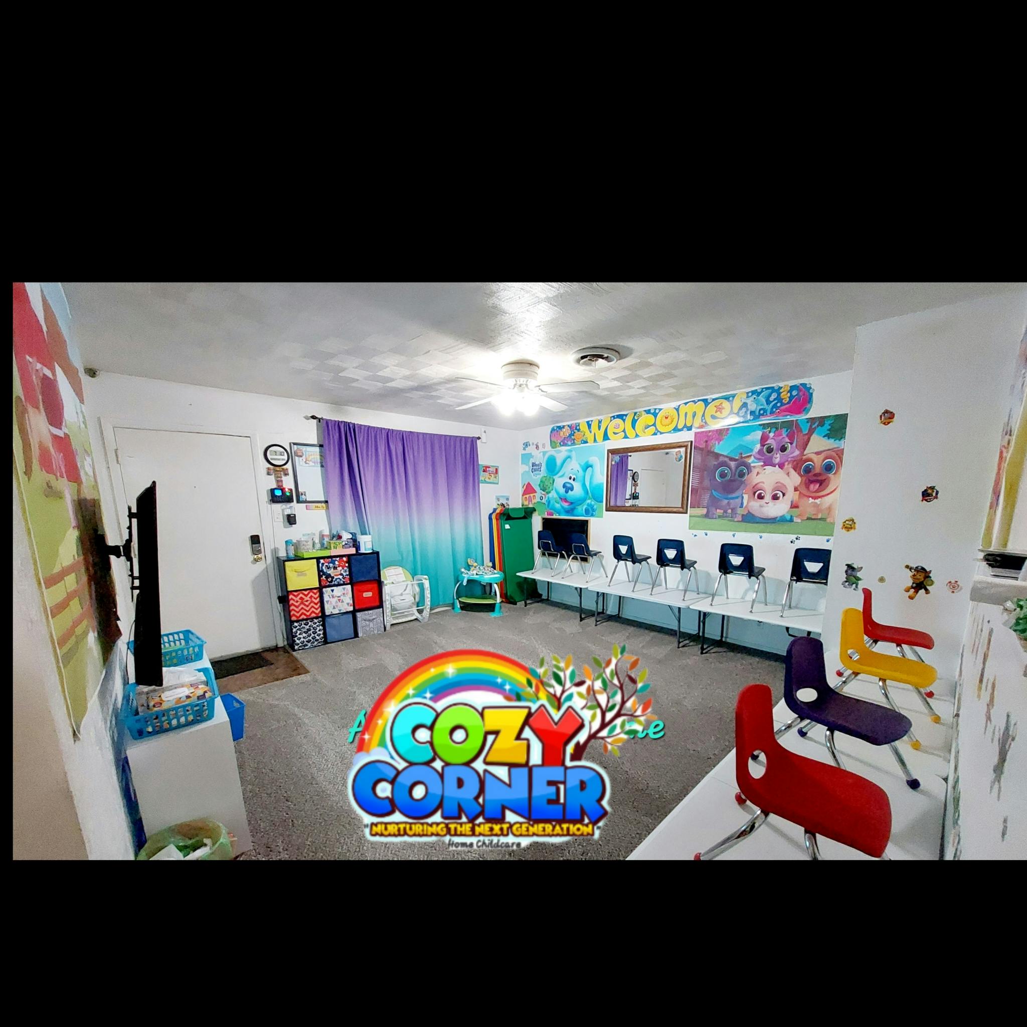 Playroom with colorful chairs, tables, and a "Cozy Corner" logo