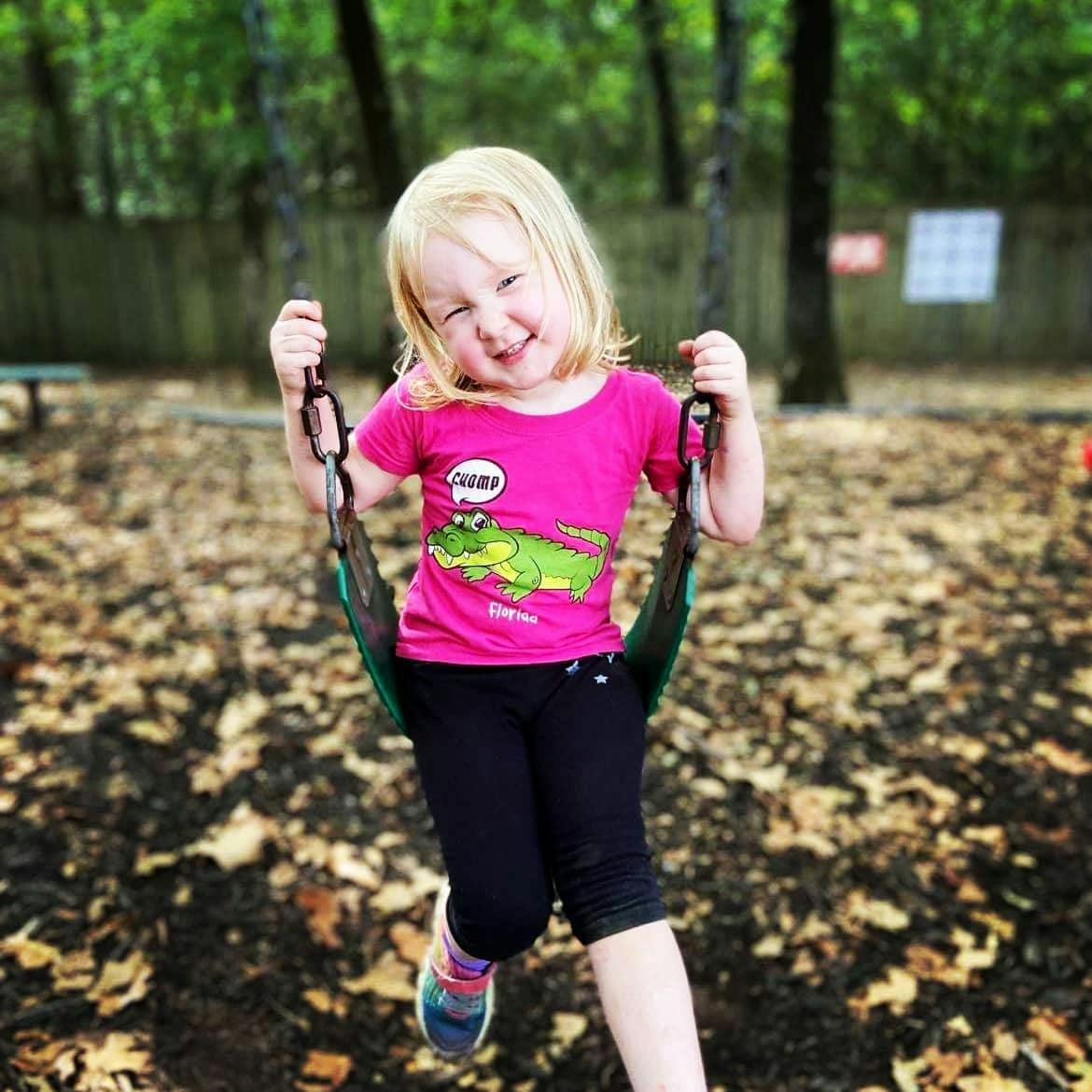 Child on a swing at a playground