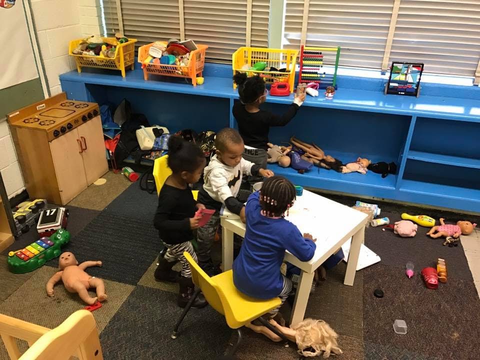 Children playing with toys in a classroom