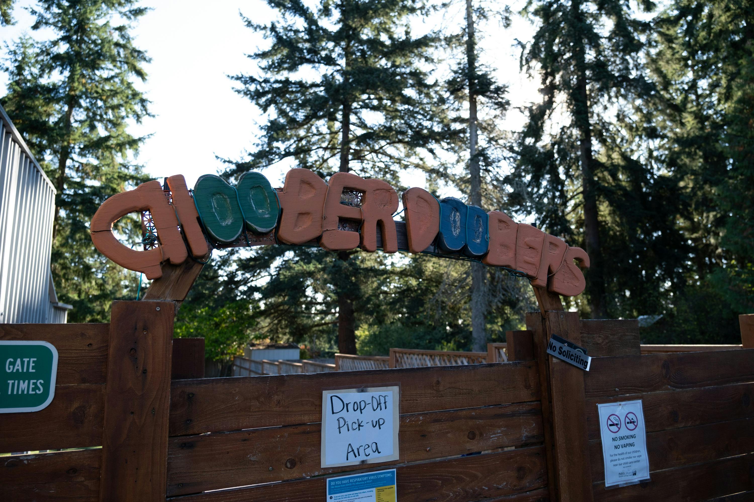 Wooden sign with text "CHOOBERDOOBERS", "Drop-Off Pick-up Area", and "No Soliciting"