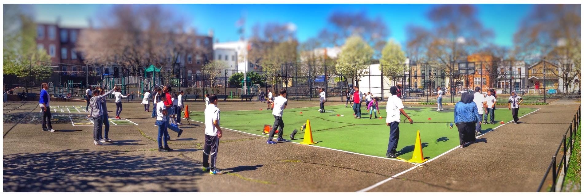 Group of people on a sports field with cones
