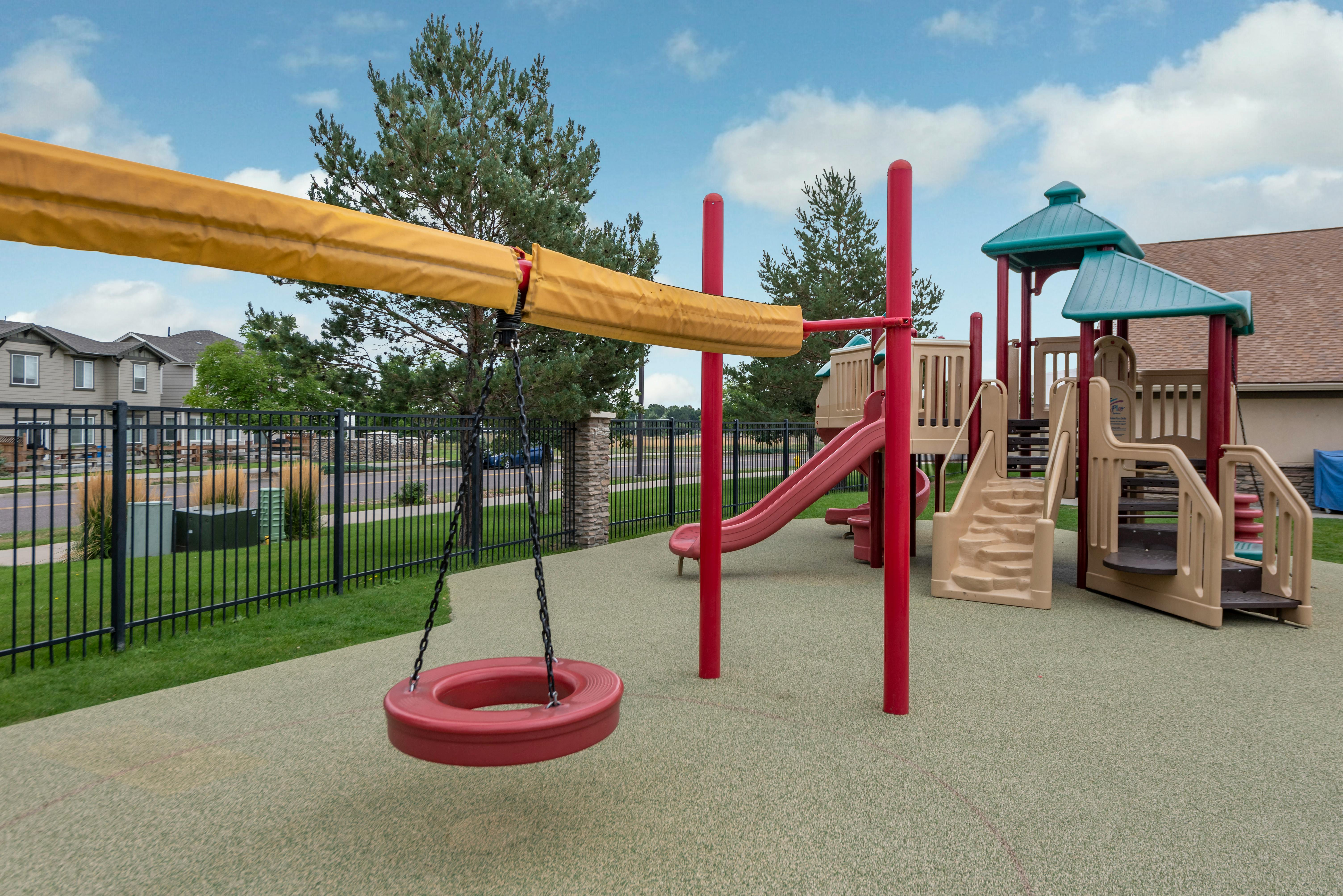 Playground with swings, slides, and climbing structures