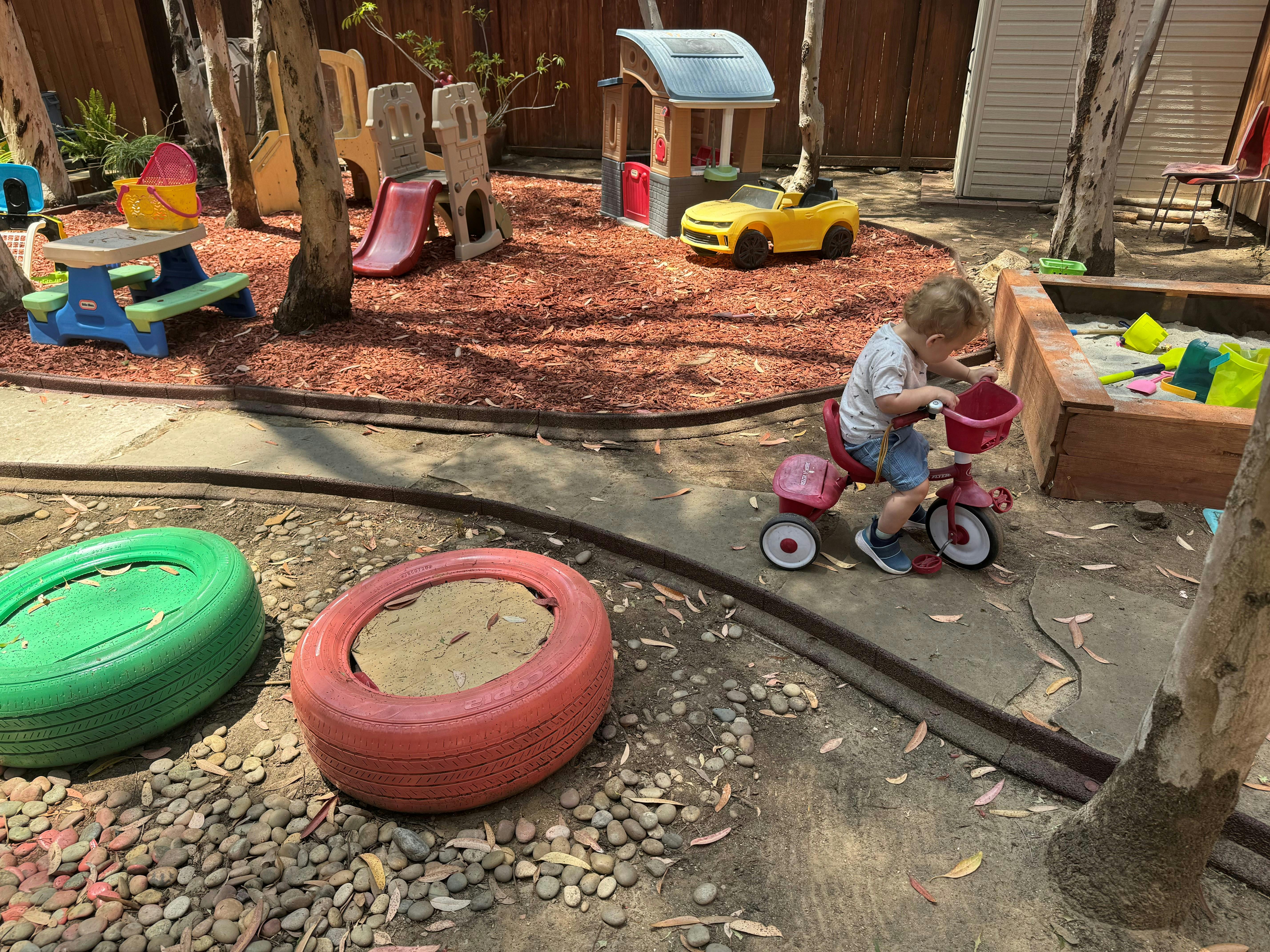 Child on a tricycle in a playground