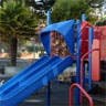Playground slide and climbing structure